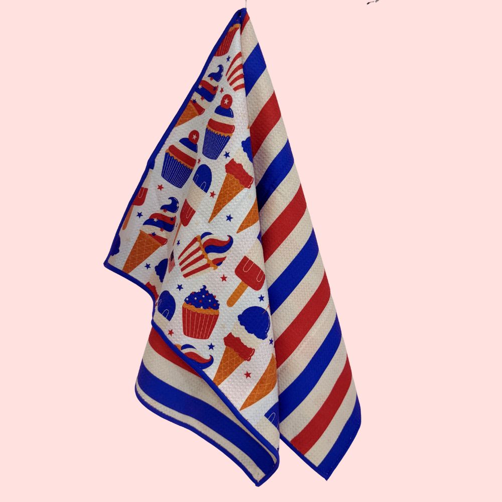 Towel with colorful 4th of July pattern on a pink background